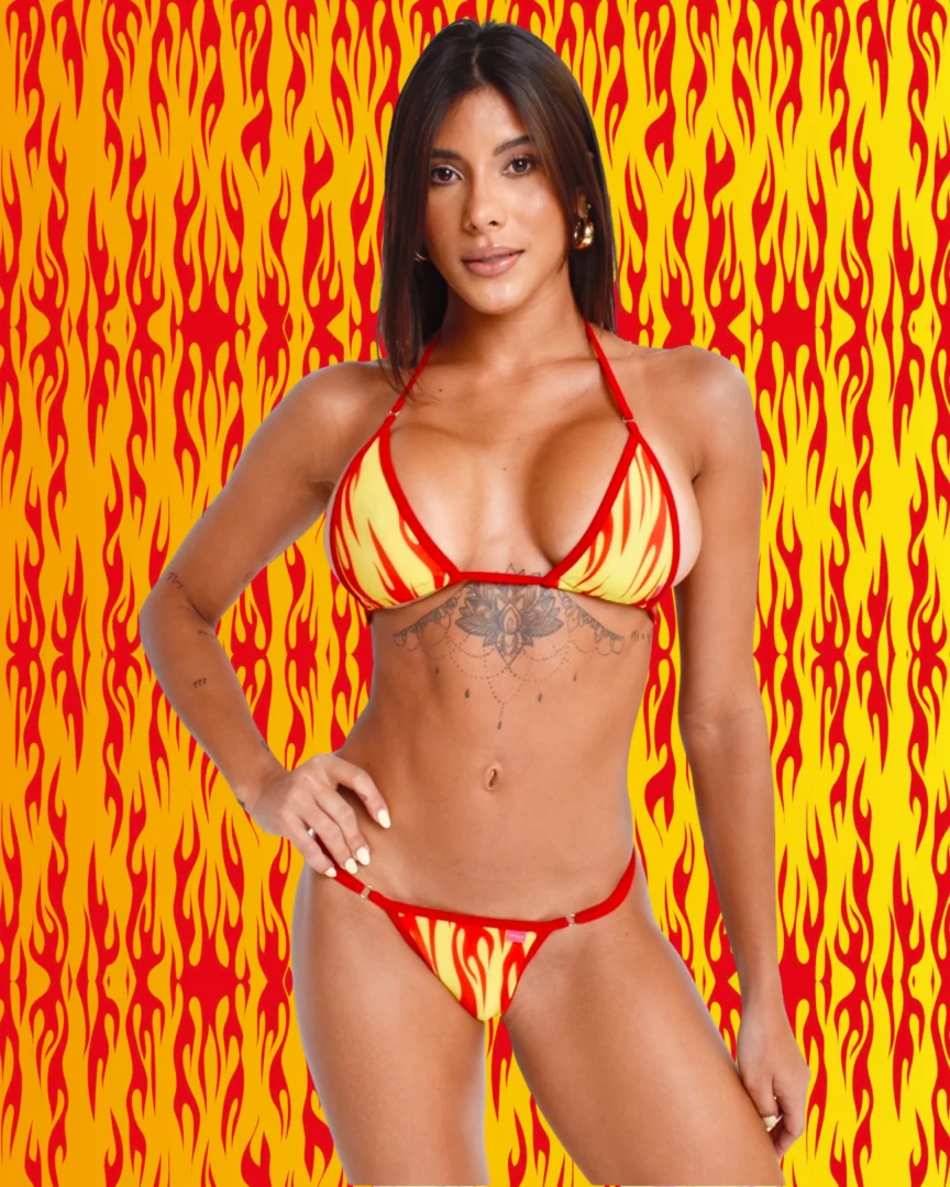 Model wearing a flames print and red straps bikini 