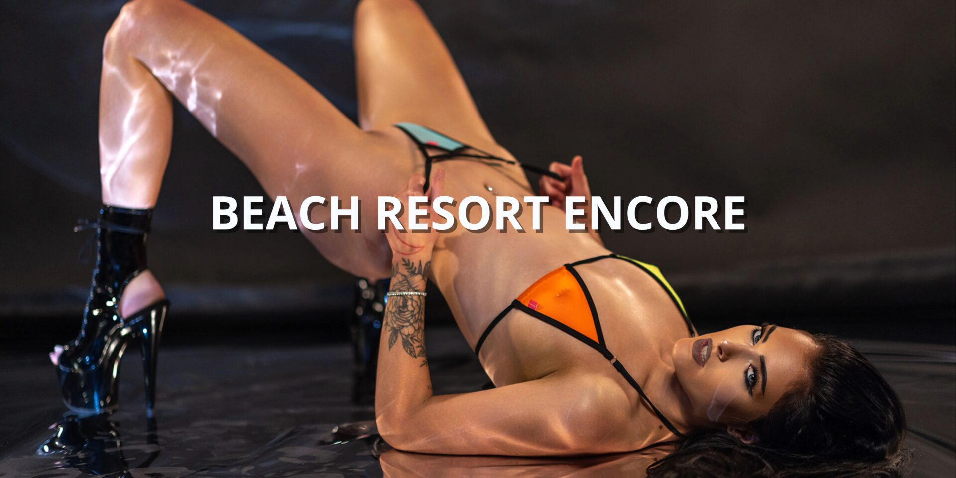 Female Model Showcasing a Sheer Micro Bikini with Blue, Orange and Yellow Color Blocks