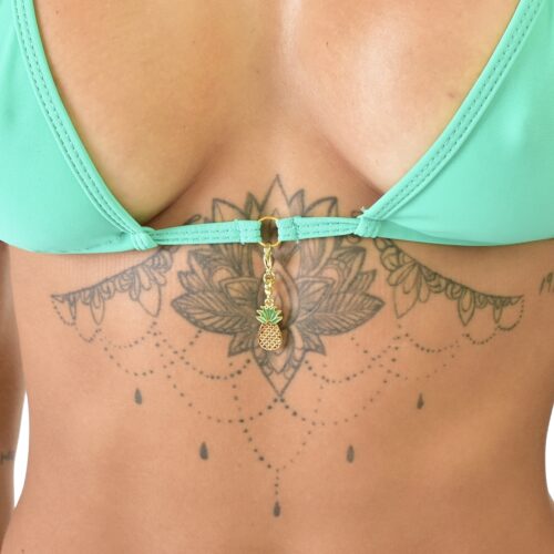 Model showcasing a close up the to the pendant of the Mint Green Bikini with Pineapple Charms