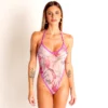 Front view of light pink sheer floral swimsuit with violet trim, high-leg halter.