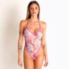 Front view of light pink sheer floral swimsuit with violet trim, high-leg halter.
